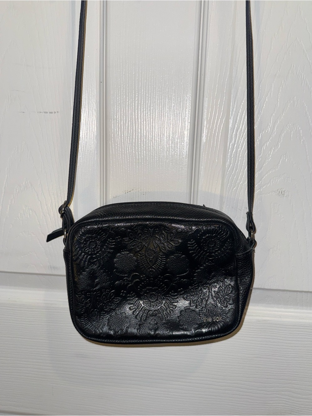The Sak De Young black leather floral embossed